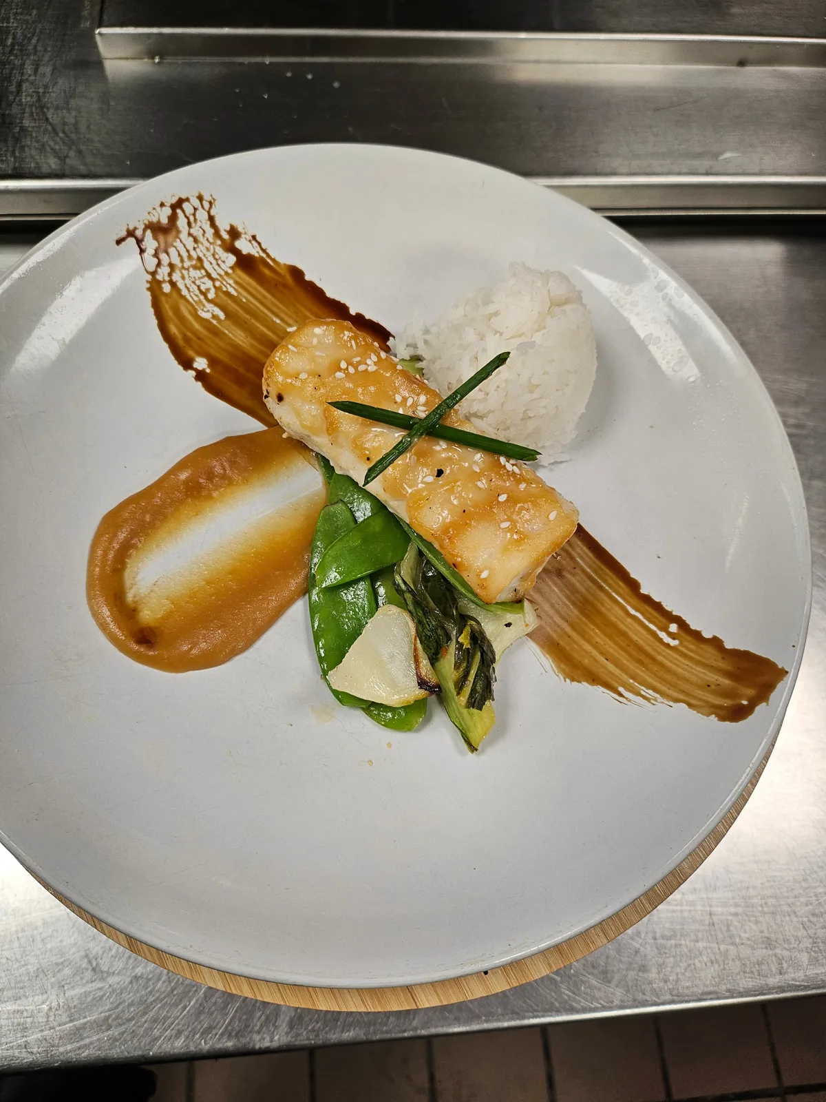 Signature dish — seared fish with jasmine rice